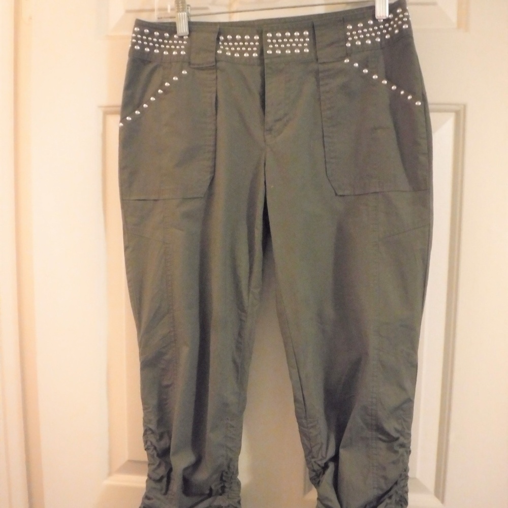 Army green capris with silver studs.